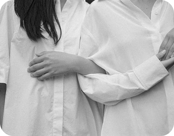 Two people with interlocked arms