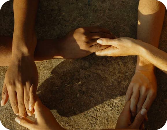 Hands providing postnatal care and support